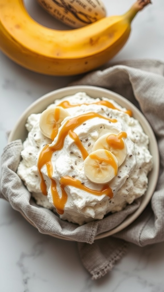 A creamy cottage cheese bowl topped with banana slices and almond butter, served in a bowl.