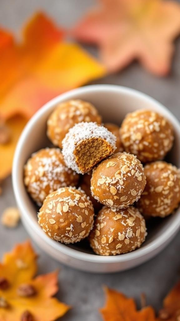 A bowl of pumpkin spice energy bites surrounded by autumn leaves.